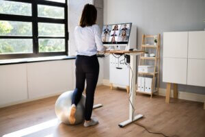 Video,Conference,Call,Using,Electric,Adjustable,Height,Standing,Desk