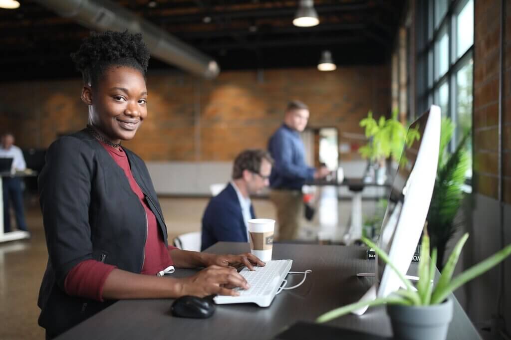 Woman smiling while working at computer