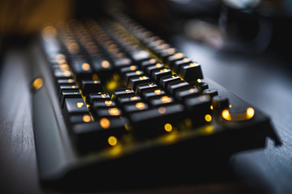 Close-up of a backlit mechanical keyboard on a desk